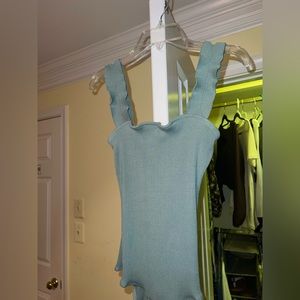 Very cute bodysuit with ruffled straps. Emerald/mint color